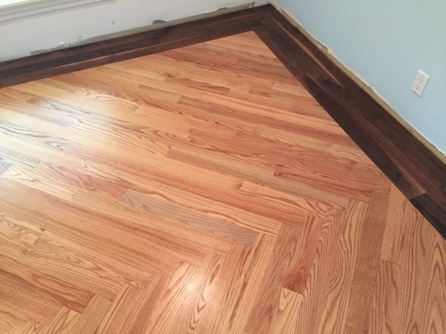 Red oak floor with walnut border