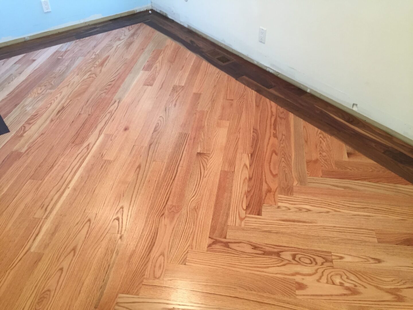 Red oak floor with walnut border