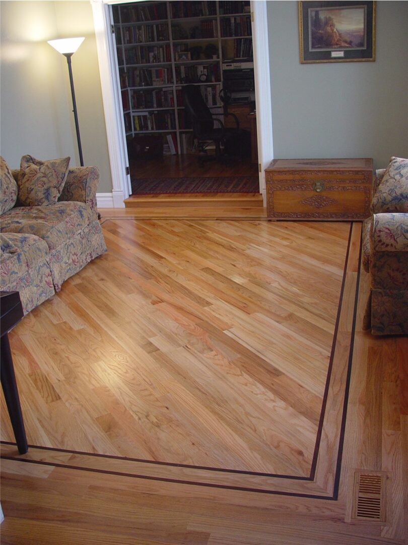 Red oak floor with walnut border inlay